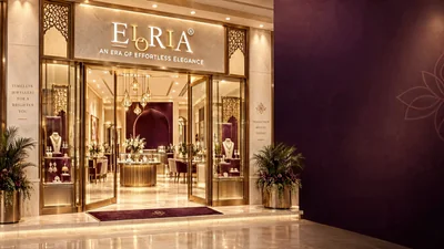 Eloria’s boutique storefront with warm gold detailing and a plum feature wall